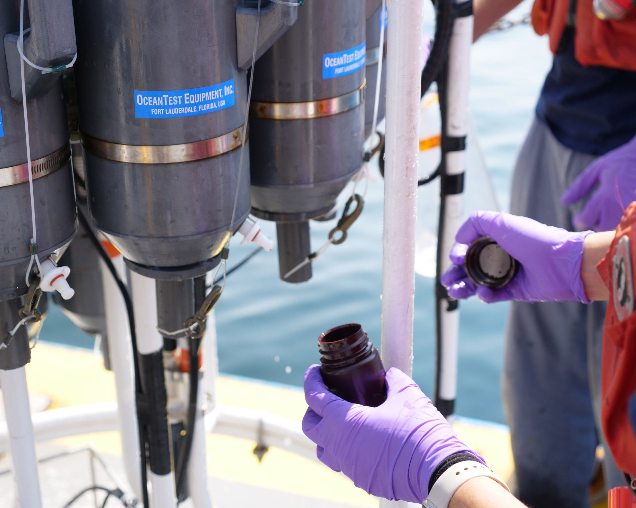 Dean collecting seaweed samples from Niskin bottles