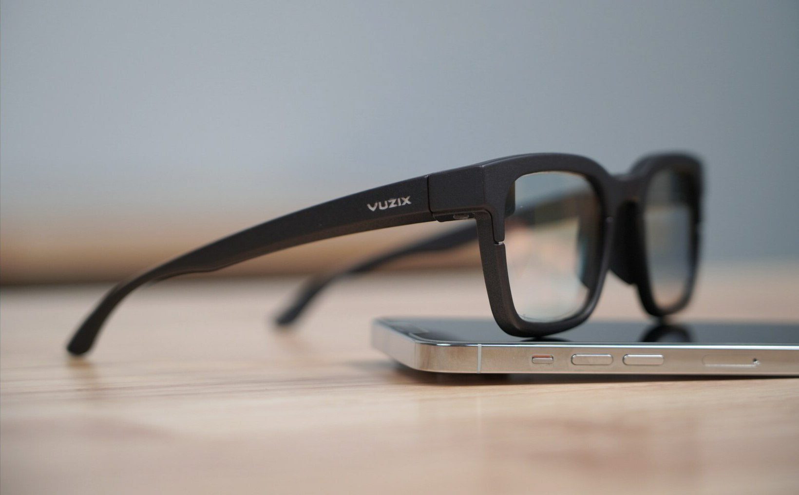 Vuzix glasses resting on a smartphone
