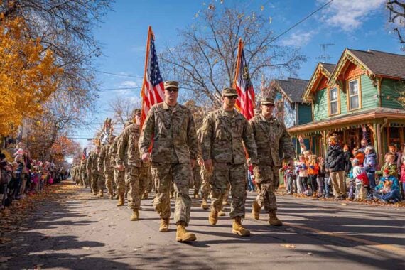 Photo of uniformed military folks marching a parade