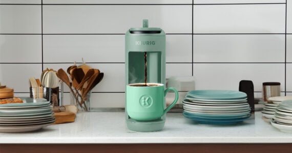 Image of the coffee maker and kitchen accessories neatly organized on a counter Image of the coffee maker and kitchen accessories neatly organized on a counter