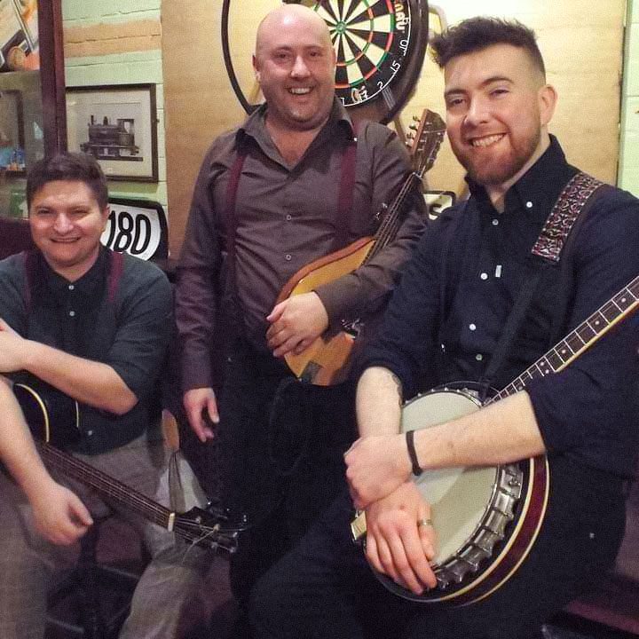 Patrick and bandmates with their instruments prior to his MND diagnosis