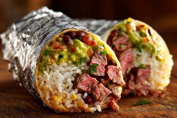 Photo of two burritos wrapped in foil