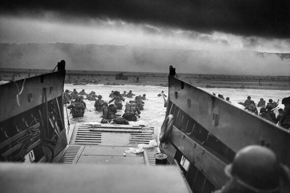Photo of troops wading ashore during D-Day. Photo of troops wading ashore during D-Day.